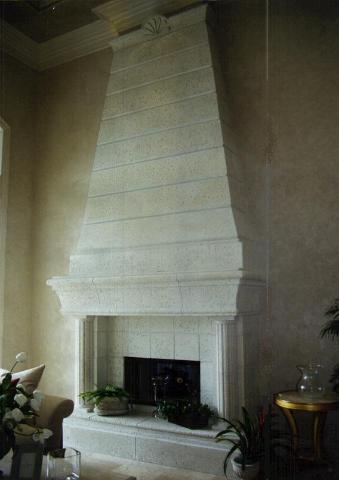 Custom Designed Cast Stone Fireplace with tapered Cast Stone Over mantel By Coral Stone.