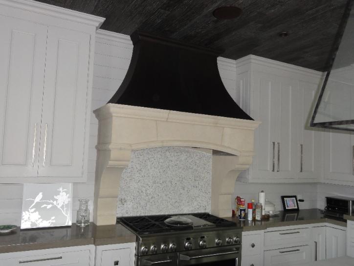 matching stone hood with fireplace design.